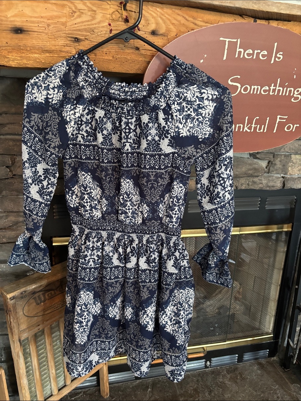 Place Navy and White Printed Dress with Smocked Detail It has a “slip” under it.